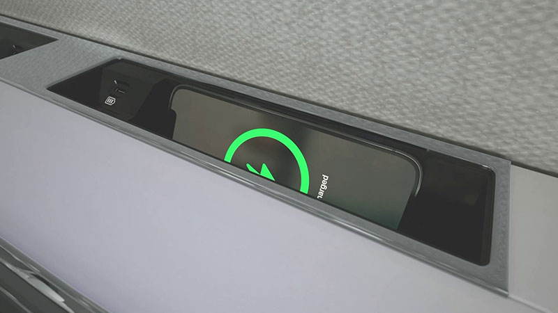 Smartphone in a charging dock in the side ledge of the Citation Ascend.