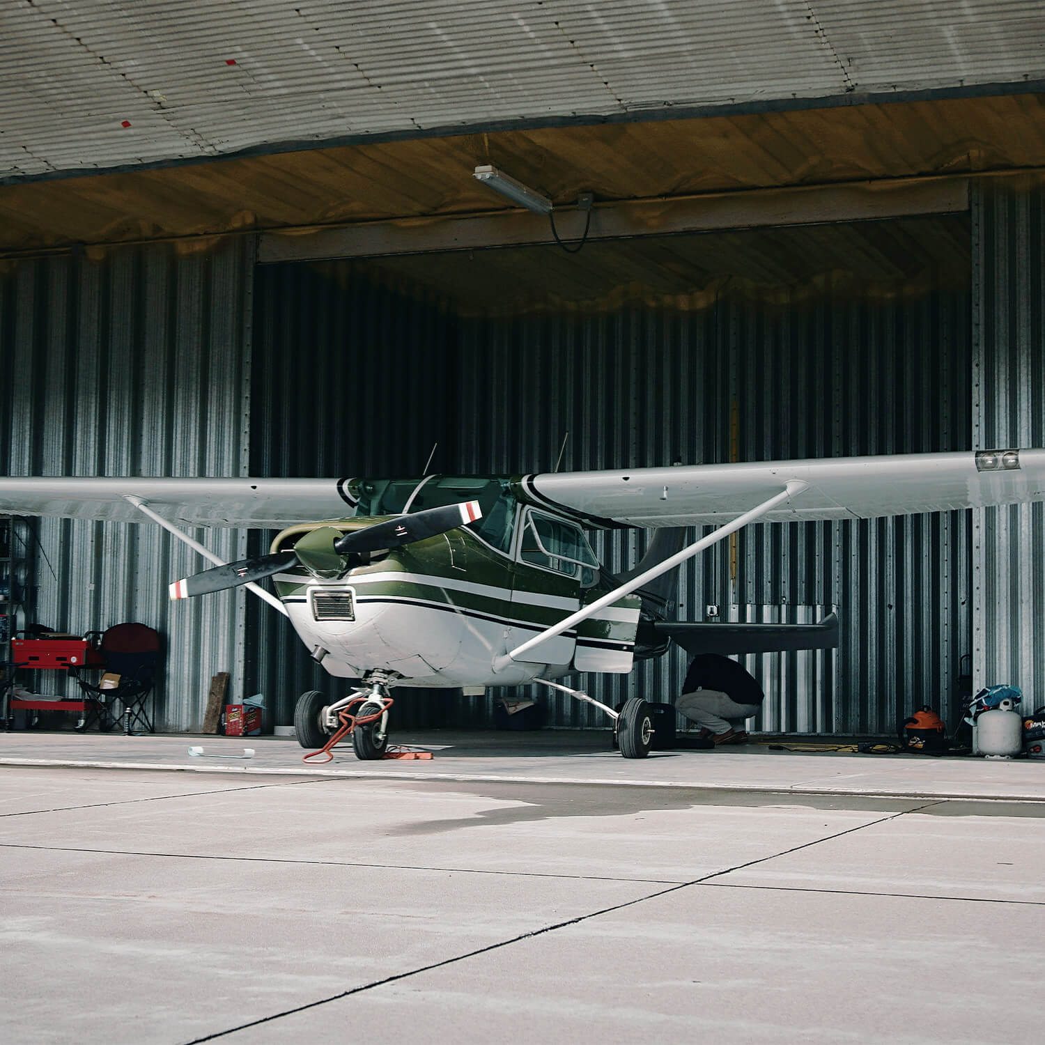 Cessna piston in a hangar.