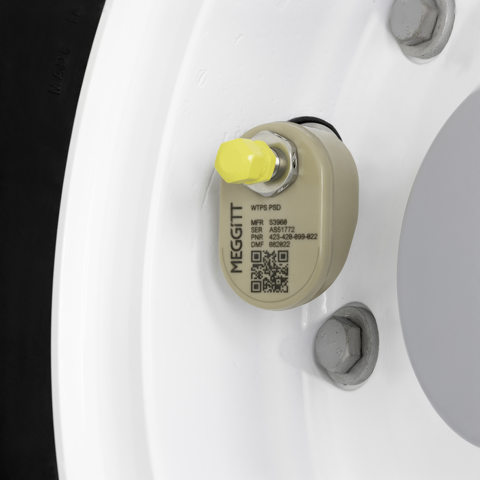 Aircraft wheel with Meggitt tire pressure sensor and yellow cap